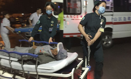 In this photo released by China's Xinhua News Agency, medical workers transport a person injured in an explosion outside a kindergarten into a hospital in Fengxian County in eastern China's Jiangsu Province early Friday, June 16, 2017. Several people were killed and dozens more injured in an explosion Thursday at the front gate of the kindergarten in eastern China as relatives were picking up their children at the end of the school day, local officials said. (Li Xiang/Xinhua via AP)