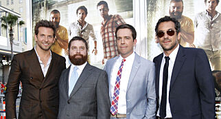 Director of the movie Todd Phillips (R) poses with cast members (from L-R) Bradley Cooper, Zach Galifianakis and Ed Helms at the premiere of "The Hangover Part II" at Grauman's Chinese theatre in Hollywood, California May 19, 2011. The movie opens in the U.S. on May 26. REUTERS/Mario Anzuoni (UNITED STATES - Tags: ENTERTAINMENT)